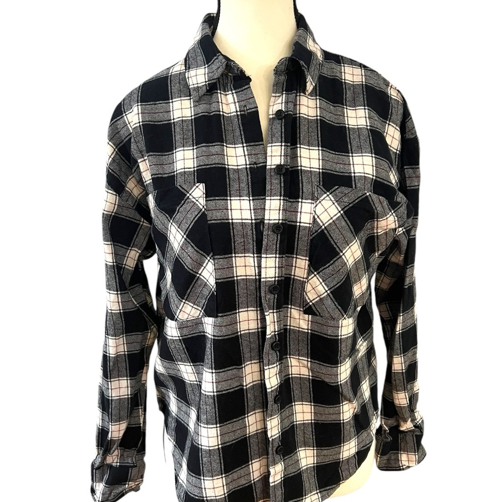 Plaid flannel shirt: black, white, gray. Button-up with two chest pockets.